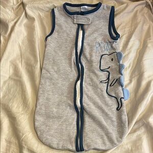 Dinosaur sleep sack swaddle arms out